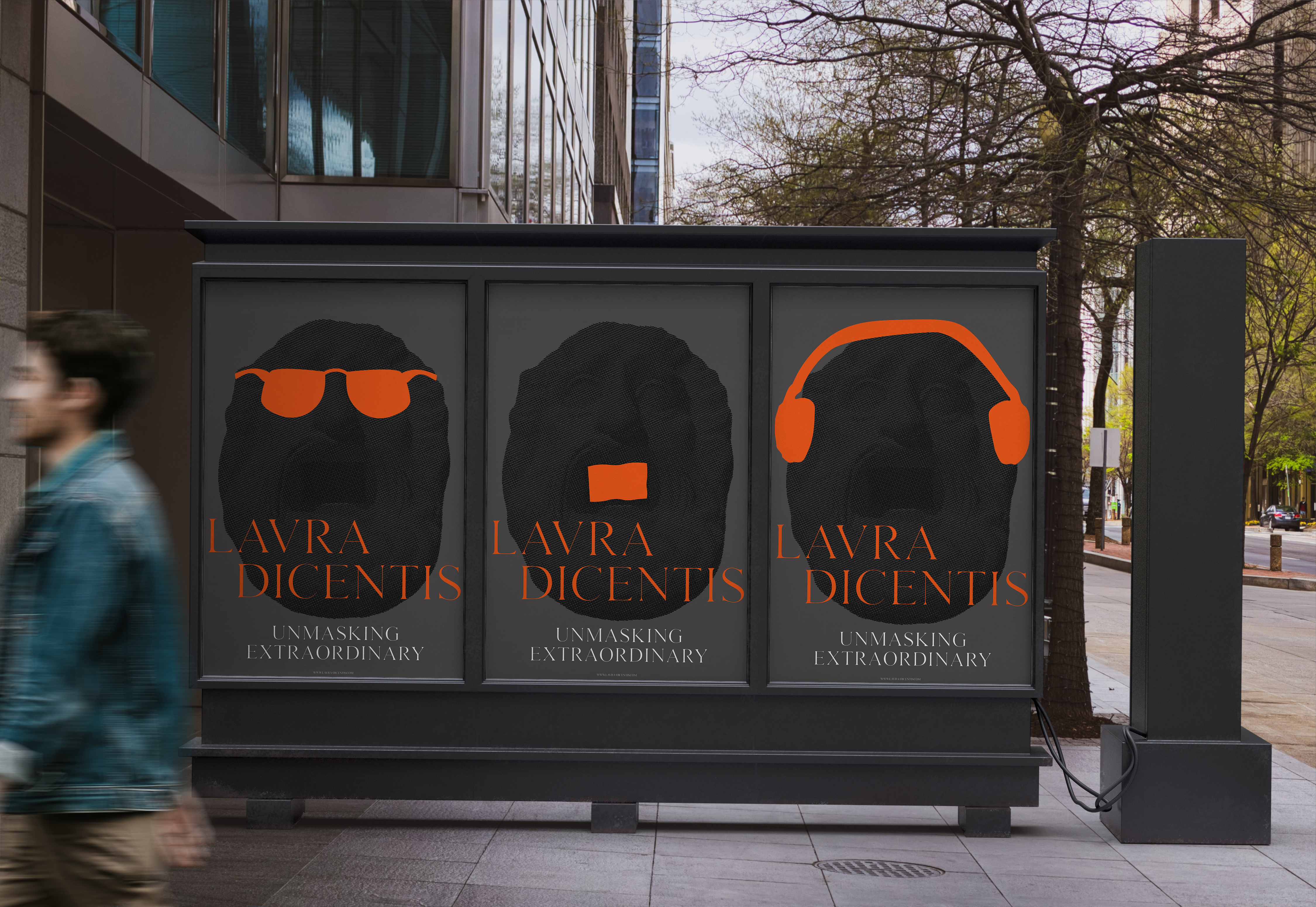 Urban billboard with Lavra Dicentis posters featuring stylized masked sculptures