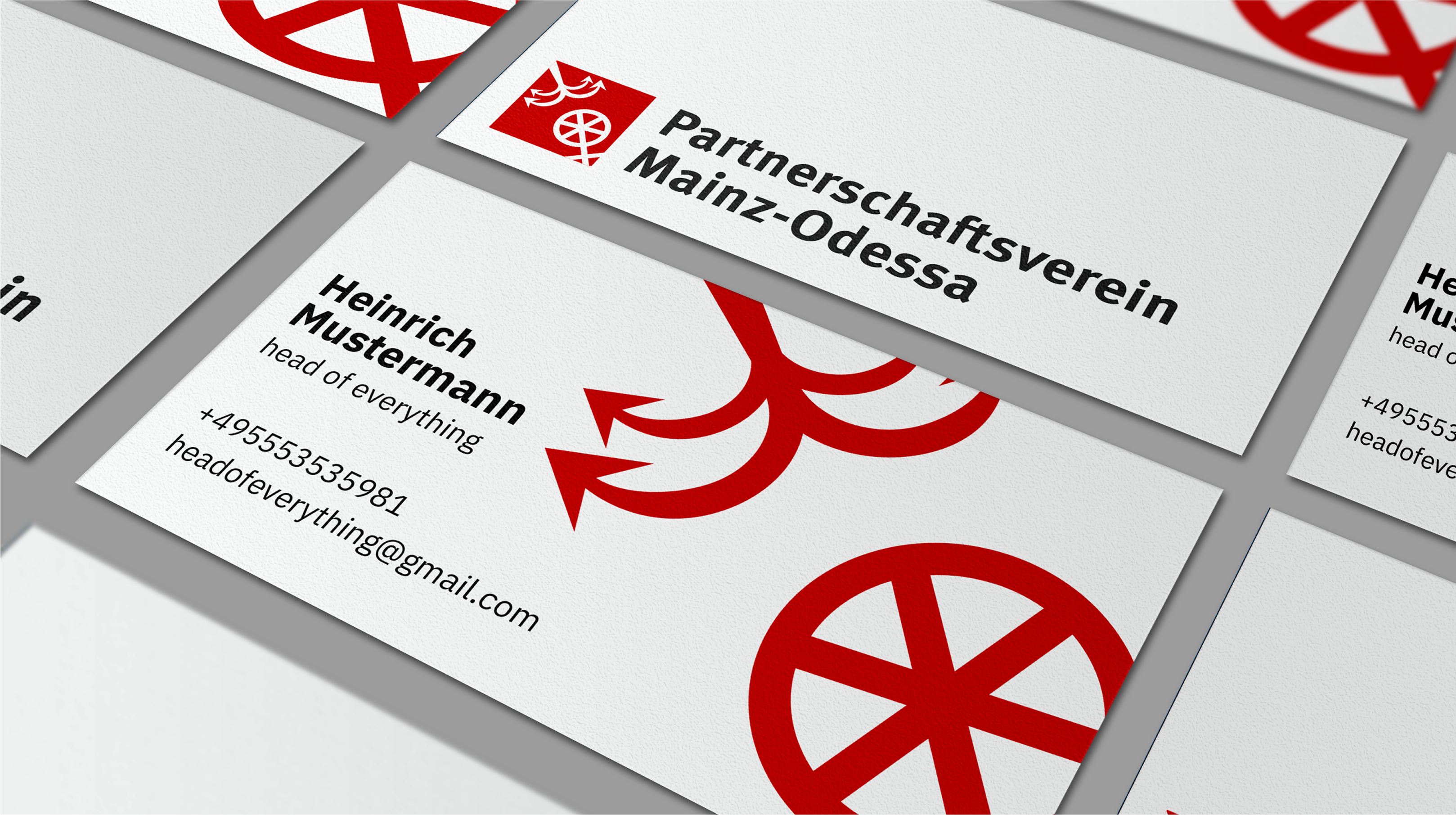 Business cards for Mainz–Odessa partnership featuring anchor and Mainz wheel logo