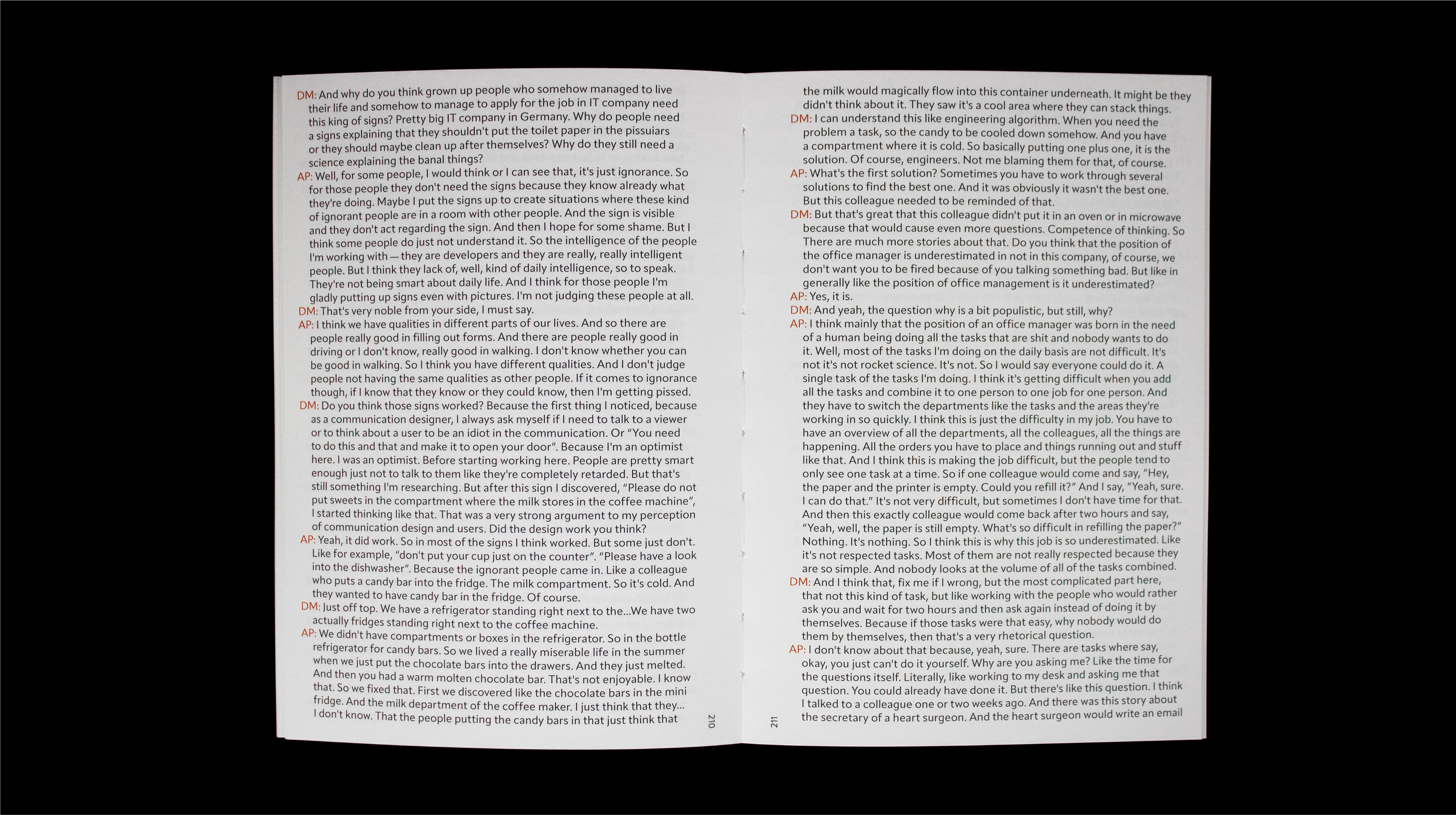 Book spread filled with red and black interview-style dialogue text
